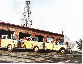 Beukendaal Fire Department with 3 yellow trucks in front
